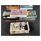 Collection of Trivial Pursuit Board Games and VHS Tapes