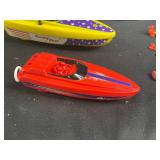 Vintage Toy Lot with Tonka Trucks, Racing Boats, and Assorted Figures