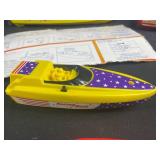 Vintage Toy Lot with Tonka Trucks, Racing Boats, and Assorted Figures