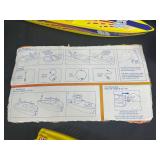 Vintage Toy Lot with Tonka Trucks, Racing Boats, and Assorted Figures