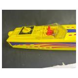 Vintage Toy Lot with Tonka Trucks, Racing Boats, and Assorted Figures