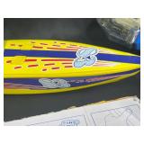 Vintage Toy Lot with Tonka Trucks, Racing Boats, and Assorted Figures