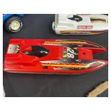 Vintage Toy Lot with Tonka Trucks, Racing Boats, and Assorted Figures