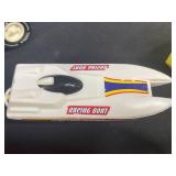 Vintage Toy Lot with Tonka Trucks, Racing Boats, and Assorted Figures