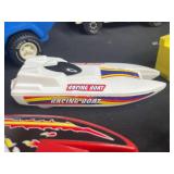 Vintage Toy Lot with Tonka Trucks, Racing Boats, and Assorted Figures