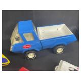 Vintage Toy Lot with Tonka Trucks, Racing Boats, and Assorted Figures