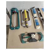 Lot of Various Sprinklers, Level, Rope and Other Garage Items