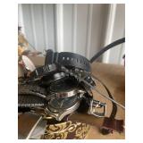 bin full of watches and watch parts