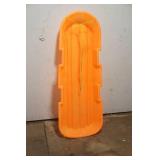 Orange plastic sled