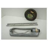 Hand truck wheel, sprinkler and level