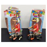 Pair of Vintage Tin Ducks on Bike Toys