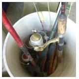 Bucket full of spinning reel fishing rods