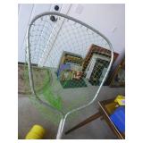 Bucket full of spinning reel fishing rods and fishing net