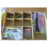 Plano tackle box full of fishing lures and worms