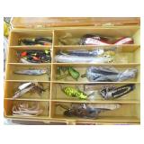 Plano tackle box full of fishing lures and worms