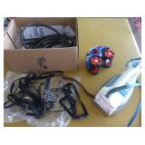 Iron, dog leashes and small jumper cables for trickle charger and a toy vehicle