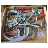 Box of tools, clamps, solder wire, saws