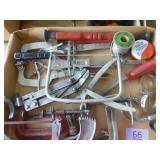Box of tools, clamps, solder wire, saws
