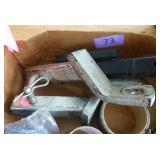 Box of hitches, flags, bow saw