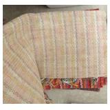 group of woven rag rugs and 3 waste baskets