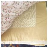 Stack of blankets and comforters