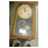 Antique wind-up clock with time and days