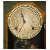 Antique wind-up clock with time and days