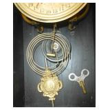 Antique wind-up clock with time and days