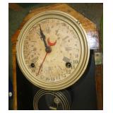 Antique wind-up clock with time and days