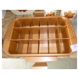 Three cake pans, two with covers and one with a cake cutter and a lift out sheet as well