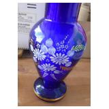 Decorative items, the blue vase is from a custom glass blower in Czechlosavakia