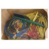 Box of extension cords and snow scraper with brush
