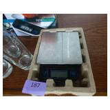 Group of glasses, plastic and glass, and a digital food scale
