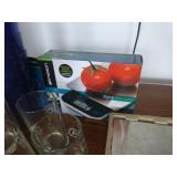 Group of glasses, plastic and glass, and a digital food scale