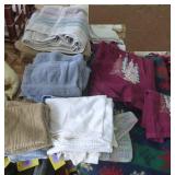 Group of towels, dish cloths, wash cloths and a blanket