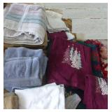 Group of towels, dish cloths, wash cloths and a blanket