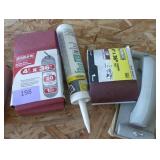 New 4x36 inch sanding belts, caulk and a hand sander