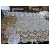 This lot has 4 large dresser scarves, some doilies and arm covers