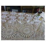 This lot has 4 large dresser scarves, some doilies and arm covers