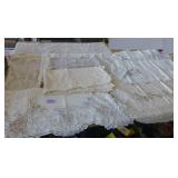 This lot has 3 table cloths and large dresser scarves
