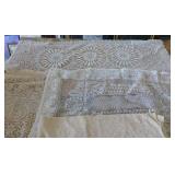 This lot has 3 table cloths and large dresser scarves