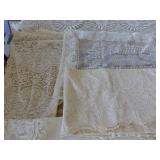 This lot has 3 table cloths and large dresser scarves