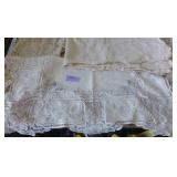 This lot has 3 table cloths and large dresser scarves