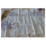 This lot has 3 table cloths and large dresser scarves