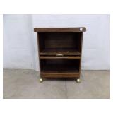 Wooden cabinet on casters
