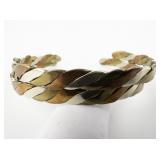 Set of two Tri-Tone Twisted Base Metal Cuff Bracelets.