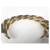 Set of two Tri-Tone Twisted Base Metal Cuff Bracelets.