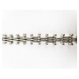 Unique White Base Metal Bracelet.