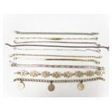 Group of 10 Chain, Herringbone, & Charm base Metal Bracelets.