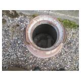 Patio umbrella with a milk can to hold it